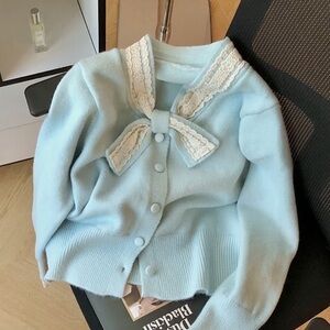 Elegant Blue Sweater with Lace Bow